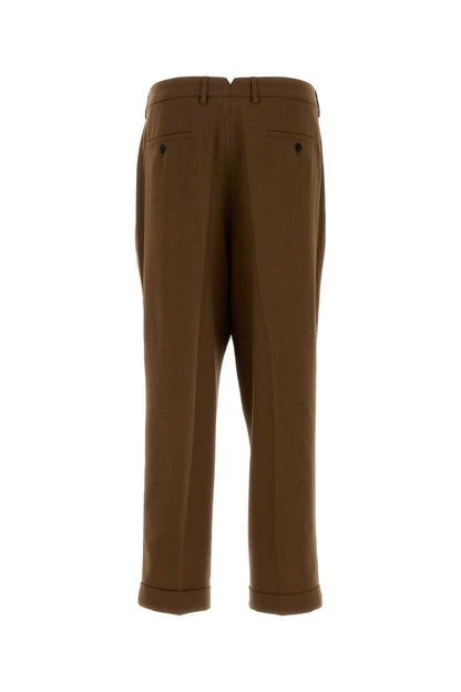 AMI Paris Carrot Trousers HTR111WV0066-216 men's trousers in Brown